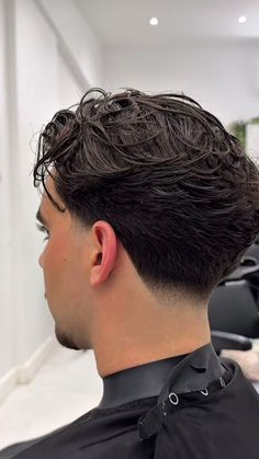 Temporary reference showing a textured wavy haircut
